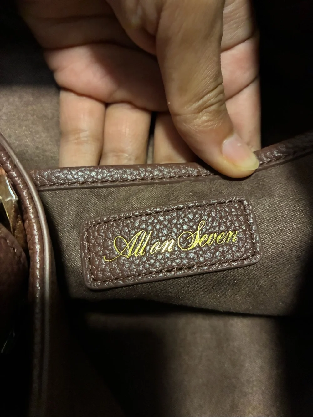 All on seven pebbled leather chocolate bag